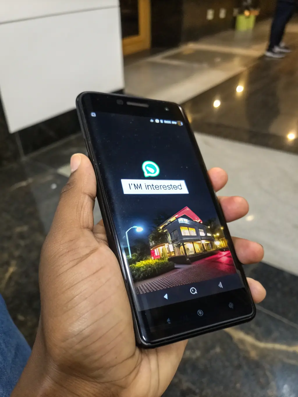 A hand holding a smartphone displaying a WhatsApp chat interface with the AllYourStay logo as the profile picture. The chat shows a message being sent with a property link.